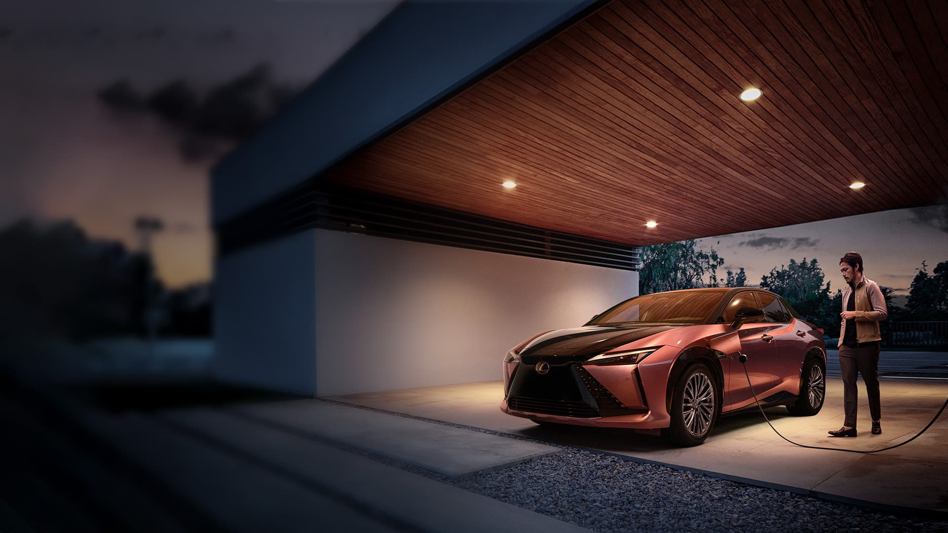 Lexus RZ parked and plugged to charge